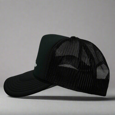 Black mesh cap with 'Cabover" on a gray background left view