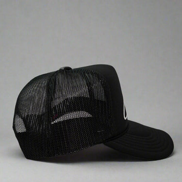 Black mesh cap with 'Cabover" on a gray background right view