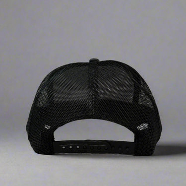 Black trucker hat with 'Keep On Truckin'' text and mountain graphic back view