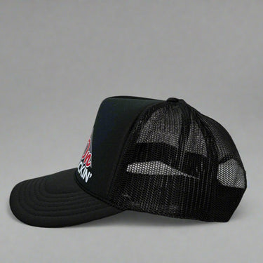 Black trucker hat with 'Keep On Truckin'' text and mountain graphic left view