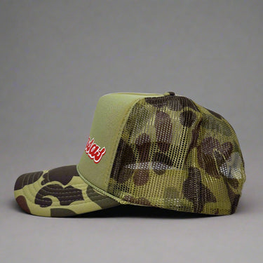 Camouflage trucker hat with mesh back left view on a gray background