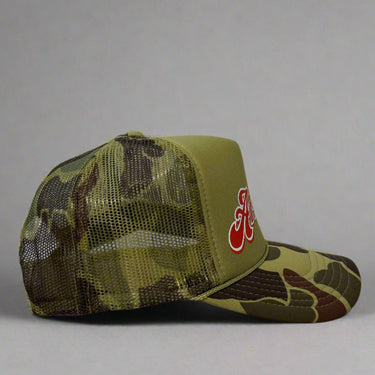 Camouflage trucker hat with mesh back, right view on a gray background