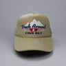Khaki trucker hat with 'Truck Around & Find Out' text and mountain design on a gray background