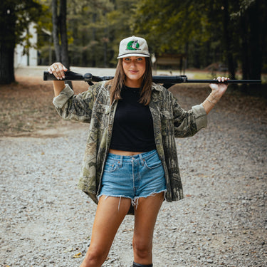 Model with gun wearing mallard express hat