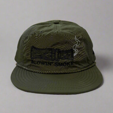 Olive green hat with blowin smoke text and duck call with smoke detail