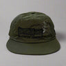 Olive green hat with blowin smoke text and duck call with smoke detail