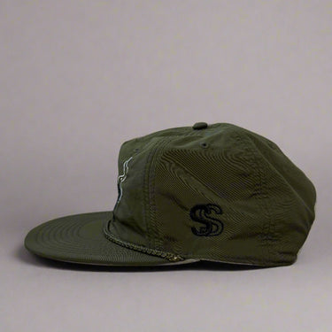 Olive green hat with blowin smoke text and duck call with smoke detail left view