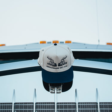 Steel Blues Trucker Hat on Truck Hood