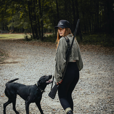 Woman walking with dog wearing Cabover hat