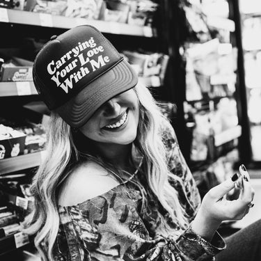 carrying your love with me trucker hat model black & white
