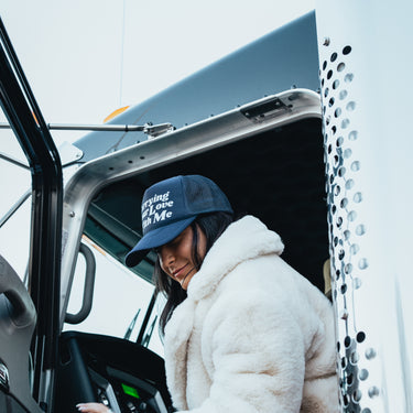 carrying your love with me trucker hat model in truck