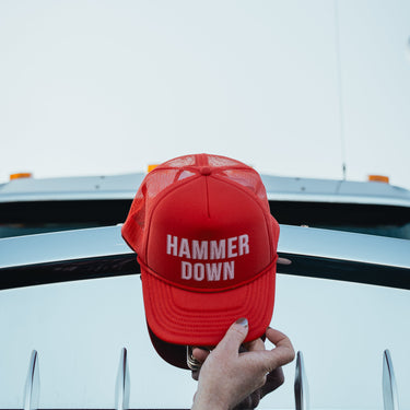 hammer down left lane trucker hat on truck hood
